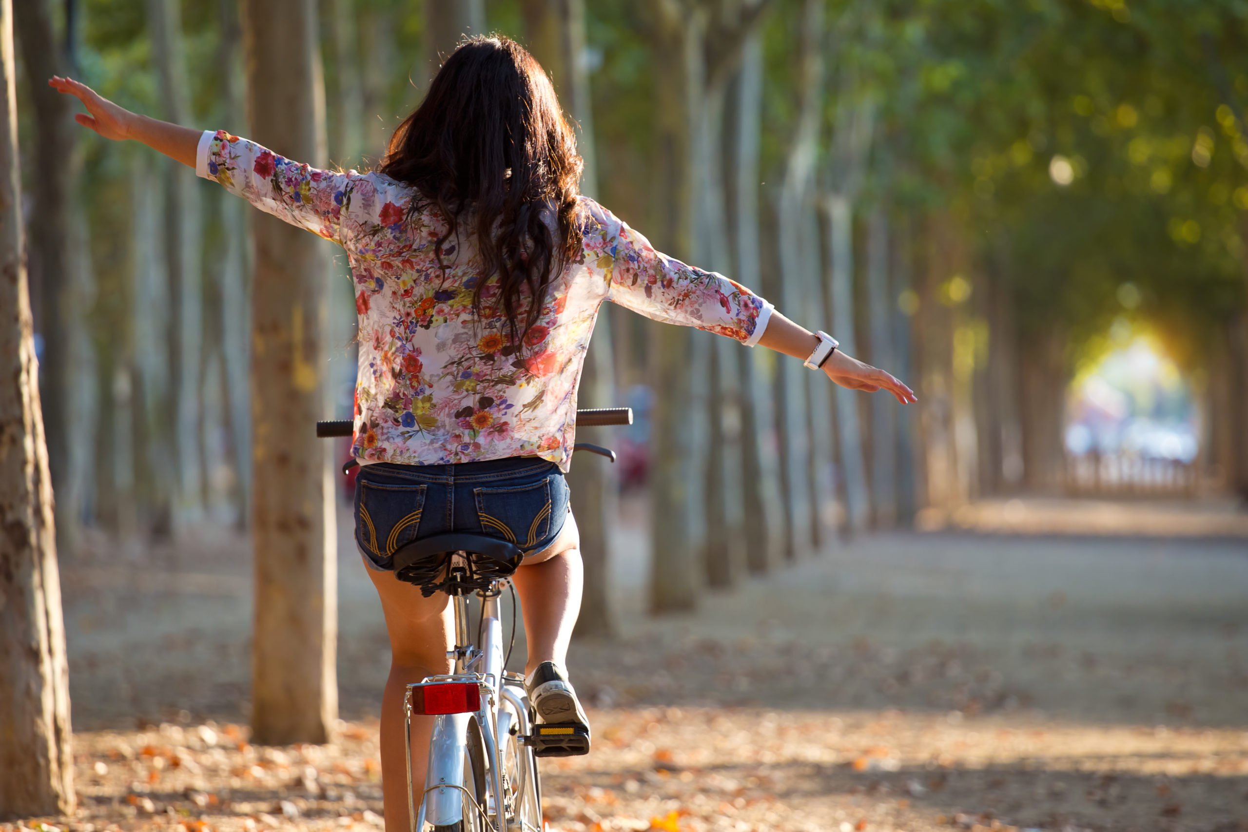 girl riding bike in forest