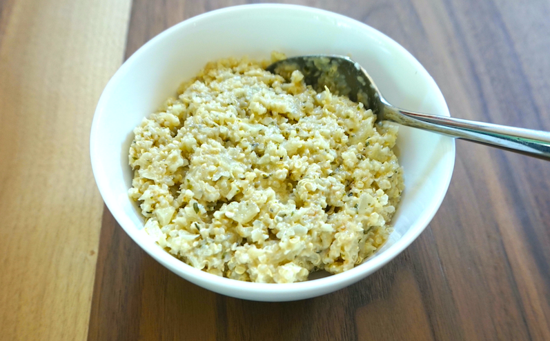 picture of quinoa risotto in a bowl with a spoon